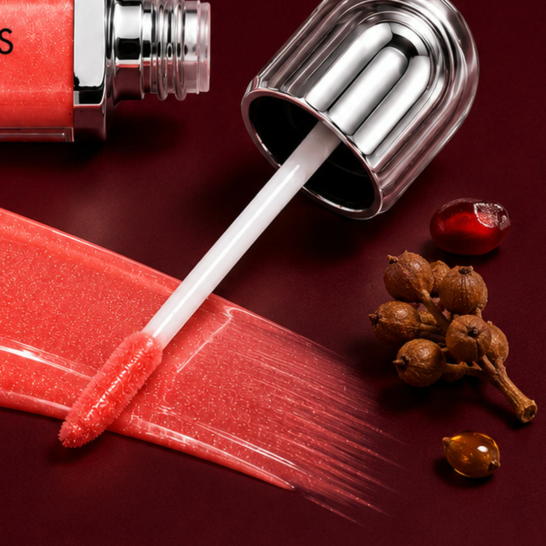 Meadowfoam seeds beside a white meadowfoam flower on a burgundy surface, an ingredient in Bella Gloss lip gloss